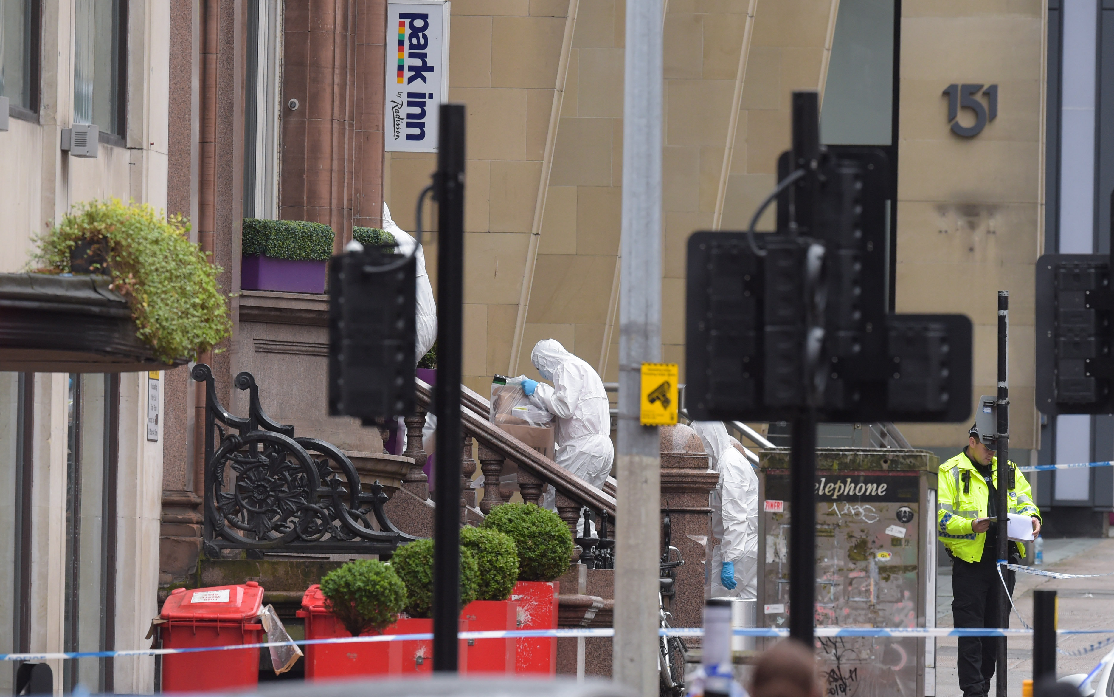 Forensics investigators carry out work at the hotel.