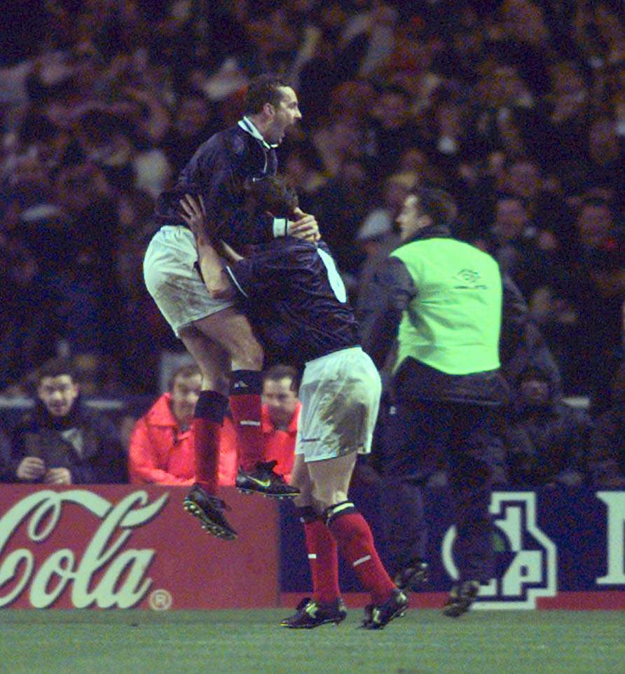 Don Hutchison celebrates his goal with Scotland team-mate Craig Burley.