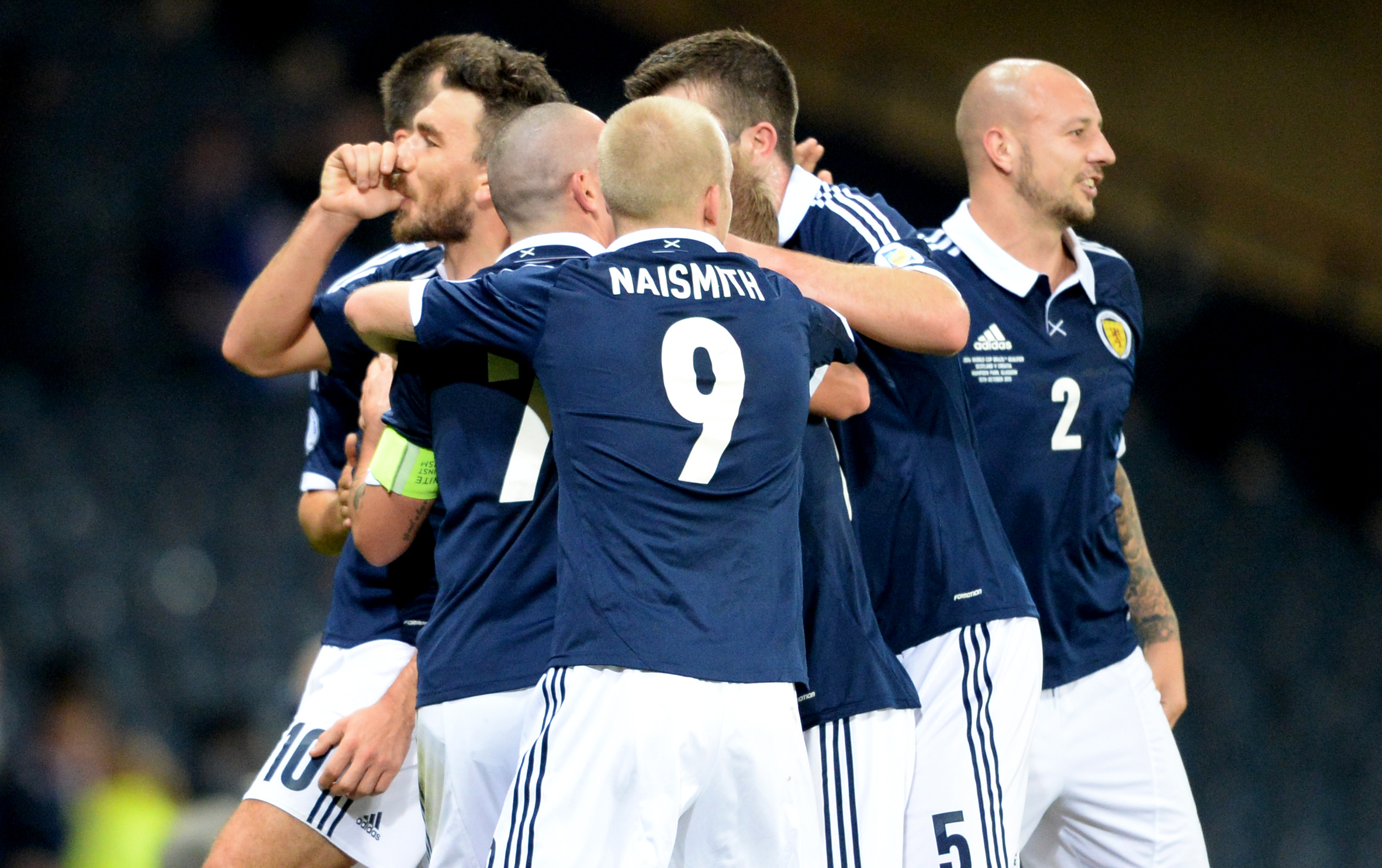 Scotland celebrate Snodgrass' goal.