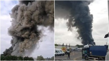 Firefighters tackle huge blaze at medical waste plant