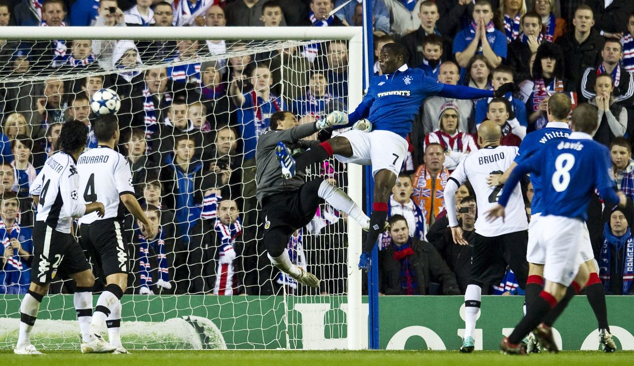 Maurice Edu puts Rangers ahead with a first-half header at Ibrox.