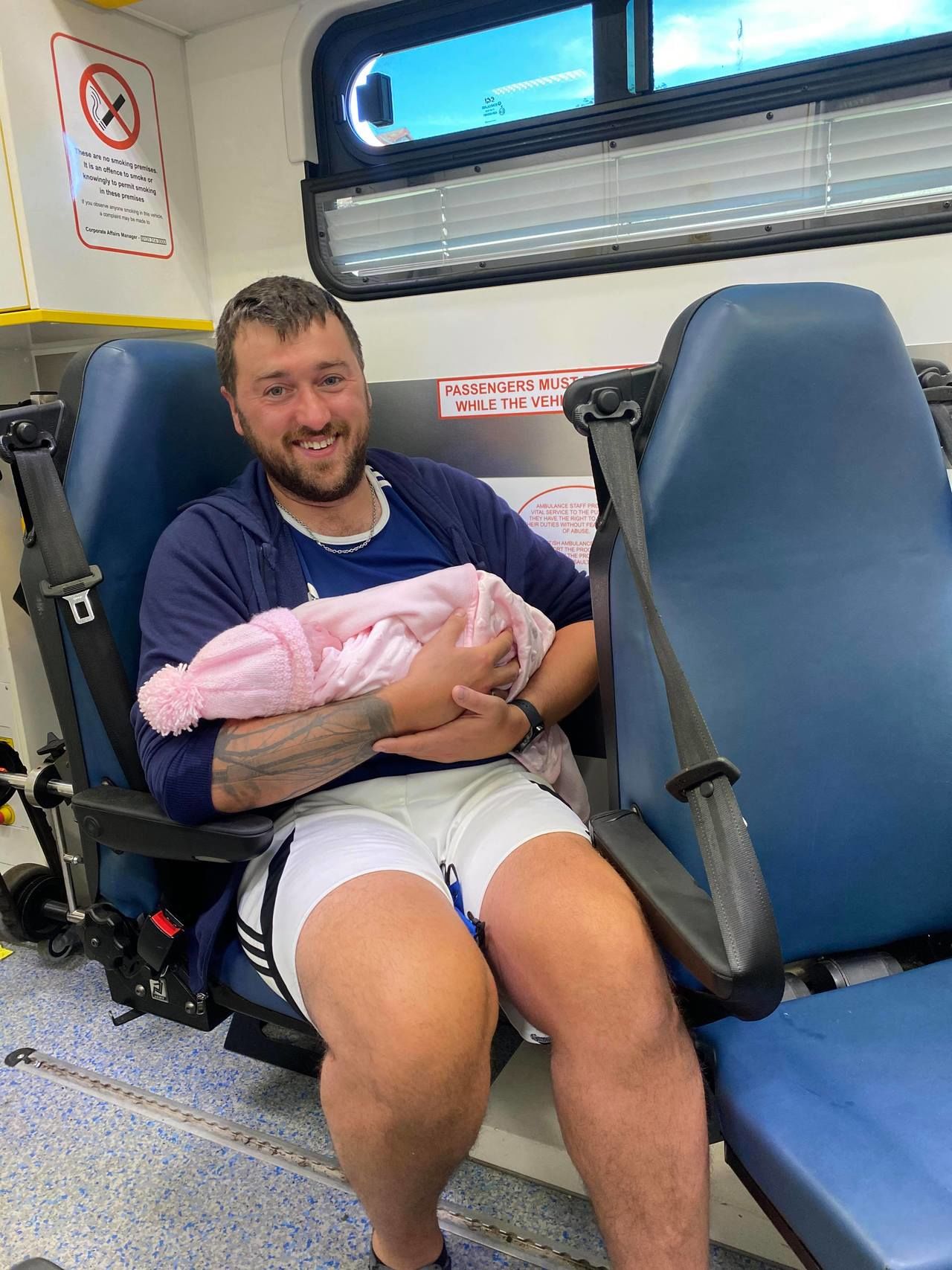 Stuart Tyrie with his newborn daughter Eve in the ambulance.