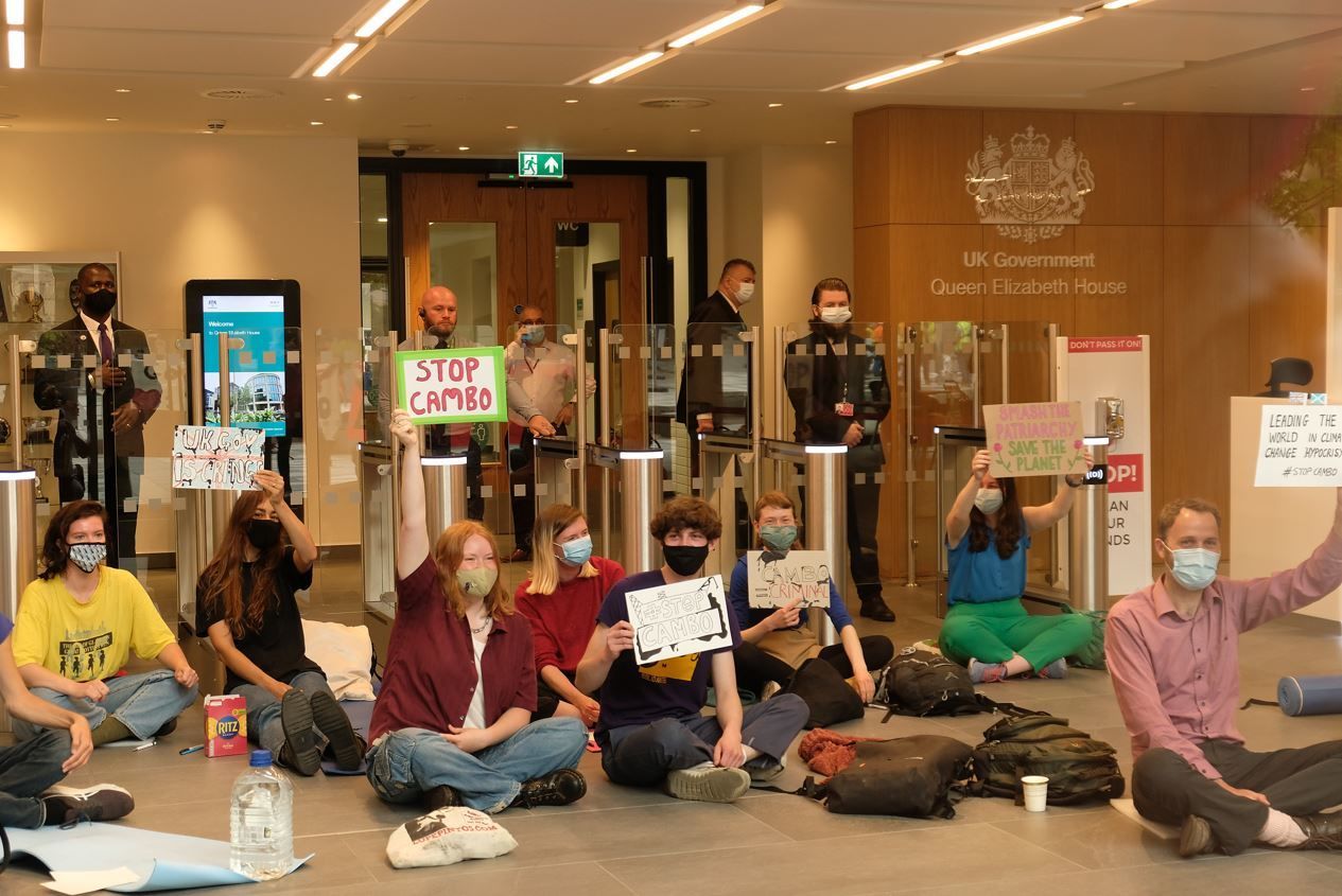 The group sat in the entrance to the building.