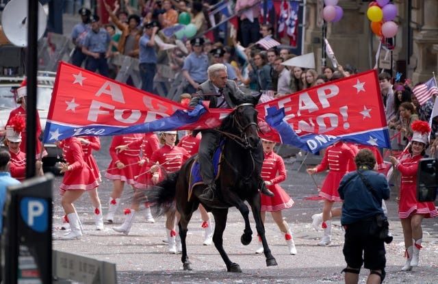 Harrison Ford's body double could be seen crashing through a banner during filming. 