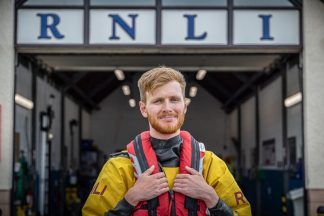 Lifeboat volunteer rescues child being swept out to sea