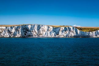 Man dies after jumping from sinking boat in English Channel
