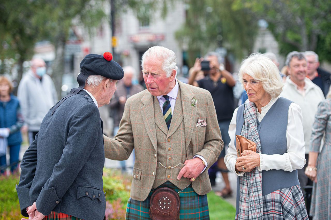 Prince of Wales and the Duchess of Cornwall, known as the Duke and Duchess of Rothesay when in Scotland, on a walk through the village during a visit to the Ballater Community & Heritage Hub in Ballater, Aberdeenshire.