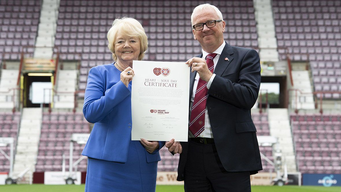 Hearts chairwoman Ann Budge and Stuart Wallace, chairman of the Foundation of Hearts, with the Heart and Soul Day certificate.