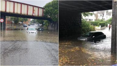 Torrential rain floods roads and forces drivers to abandon cars