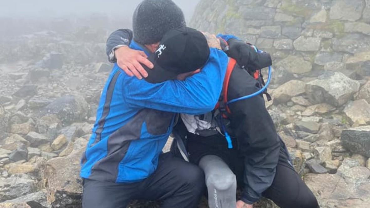 Ben Lovell tackled the Scottish mountain to raise funds for amputee children. 