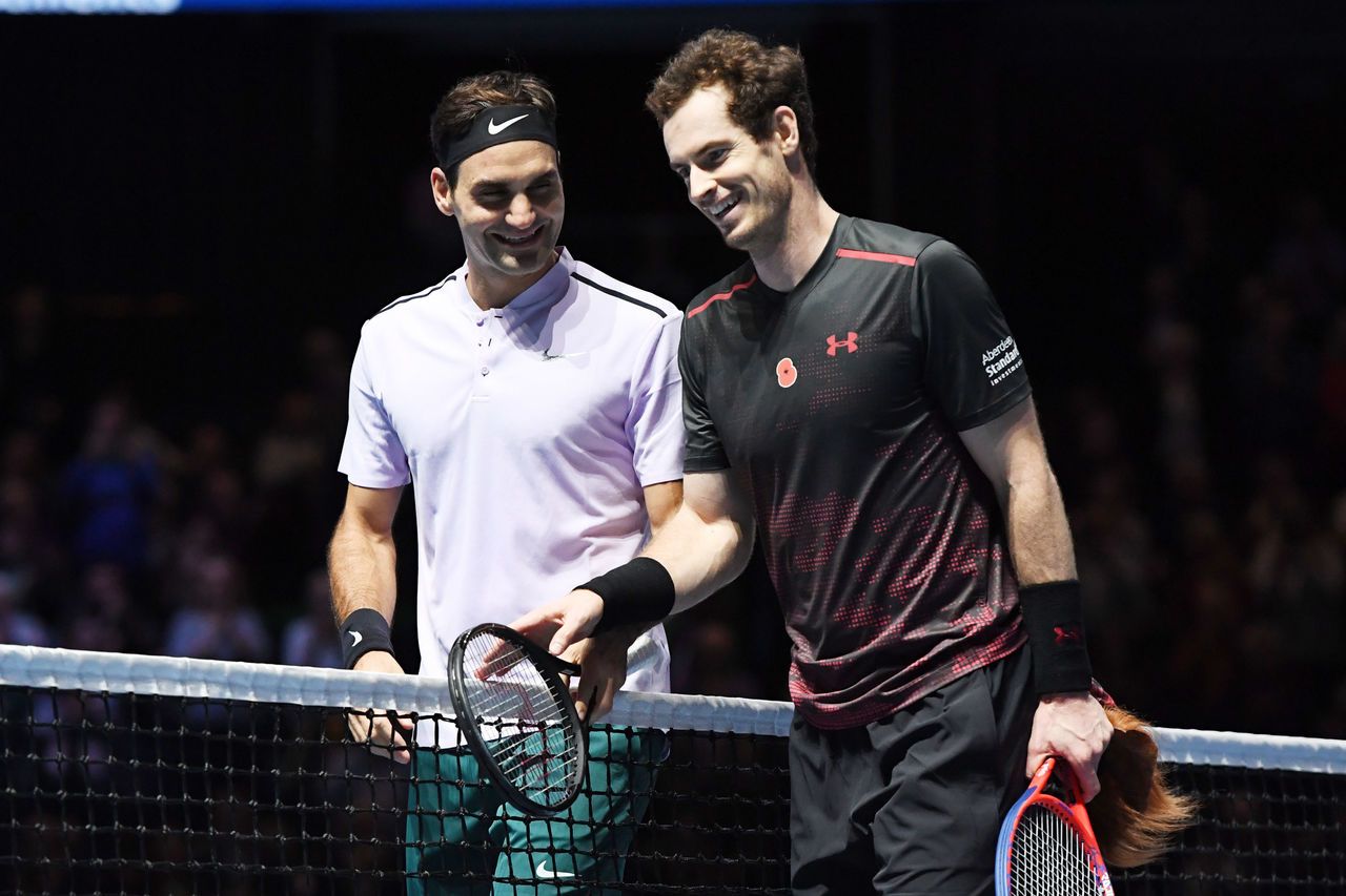 Federer and Murray share a joke at the net following their match, which the Swiss won.