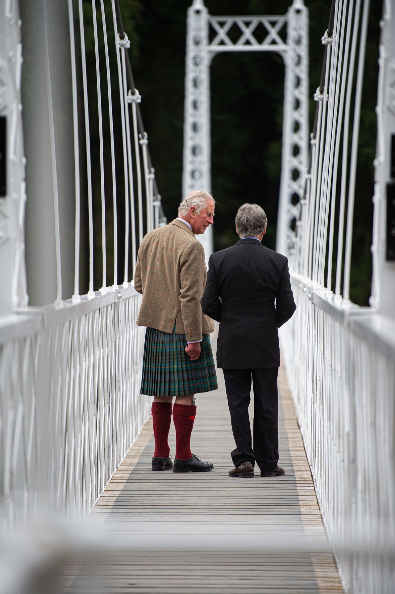 The Prince of Wales known as the Duke of Rothesay when in Scotland, with Bridges Manager, Donald Macpherson during a visit to Cambus O'May suspension bridge in Aberdeenshire following its repair.