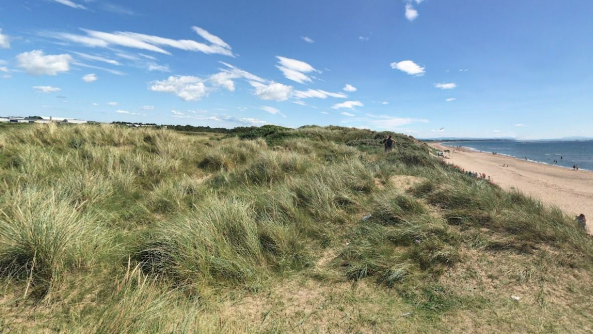 Hunt for man who performed solo sex act in beach sand dunes