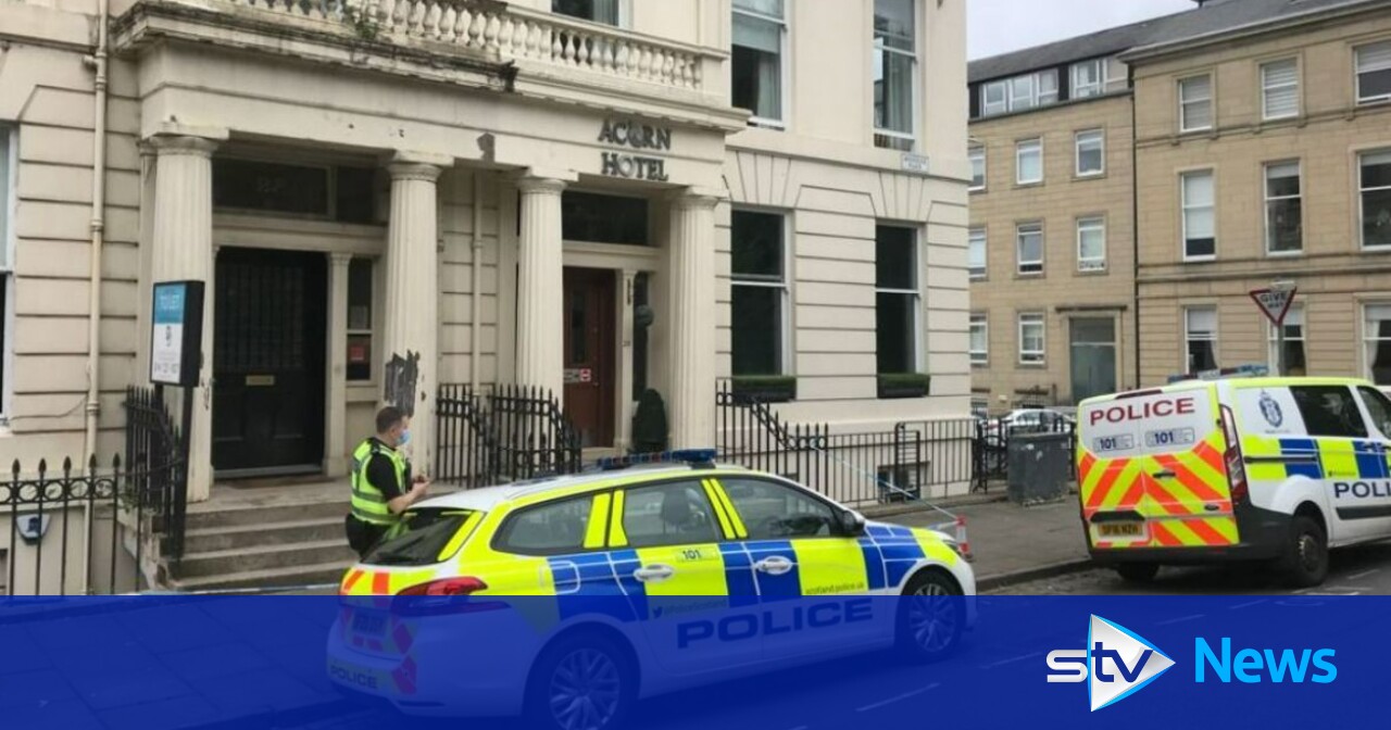 Three arrested after man found seriously injured at hotel | STV News