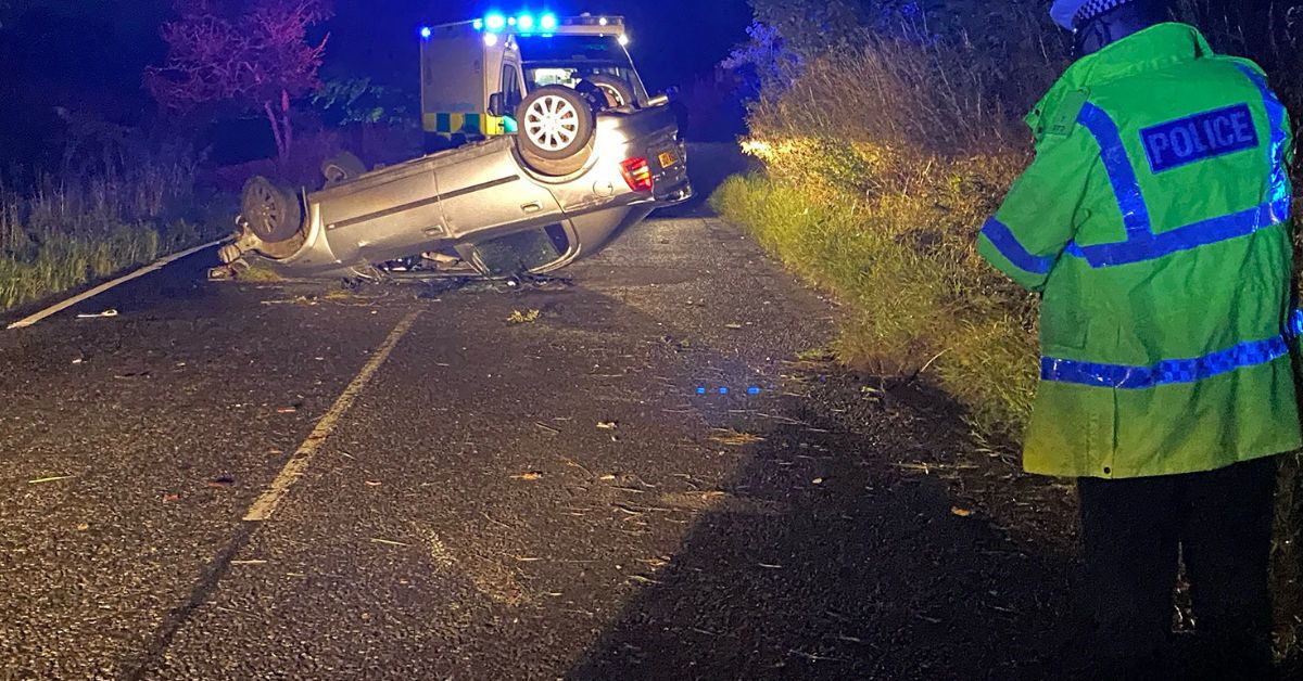 Two taken to hospital after car flips closing road