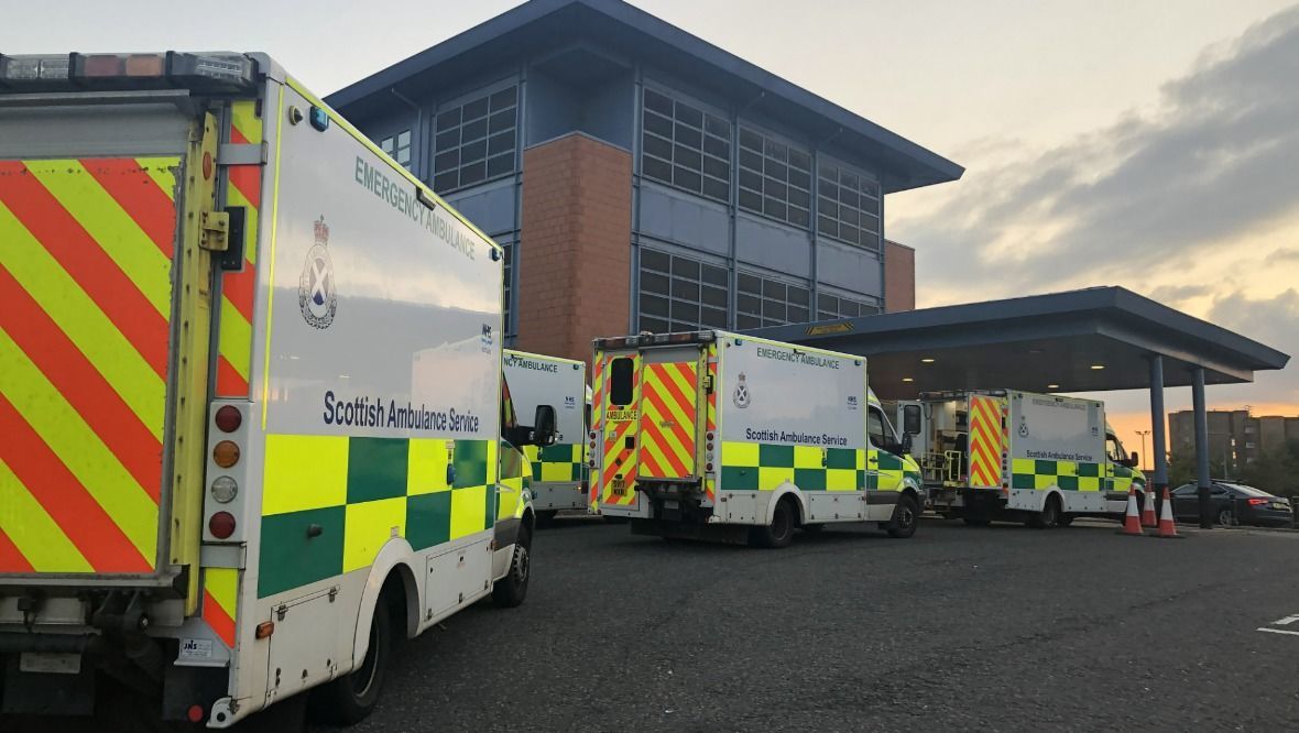 Ambulances queue outside A&E at Hairmyres Hospital in East Kilbride.