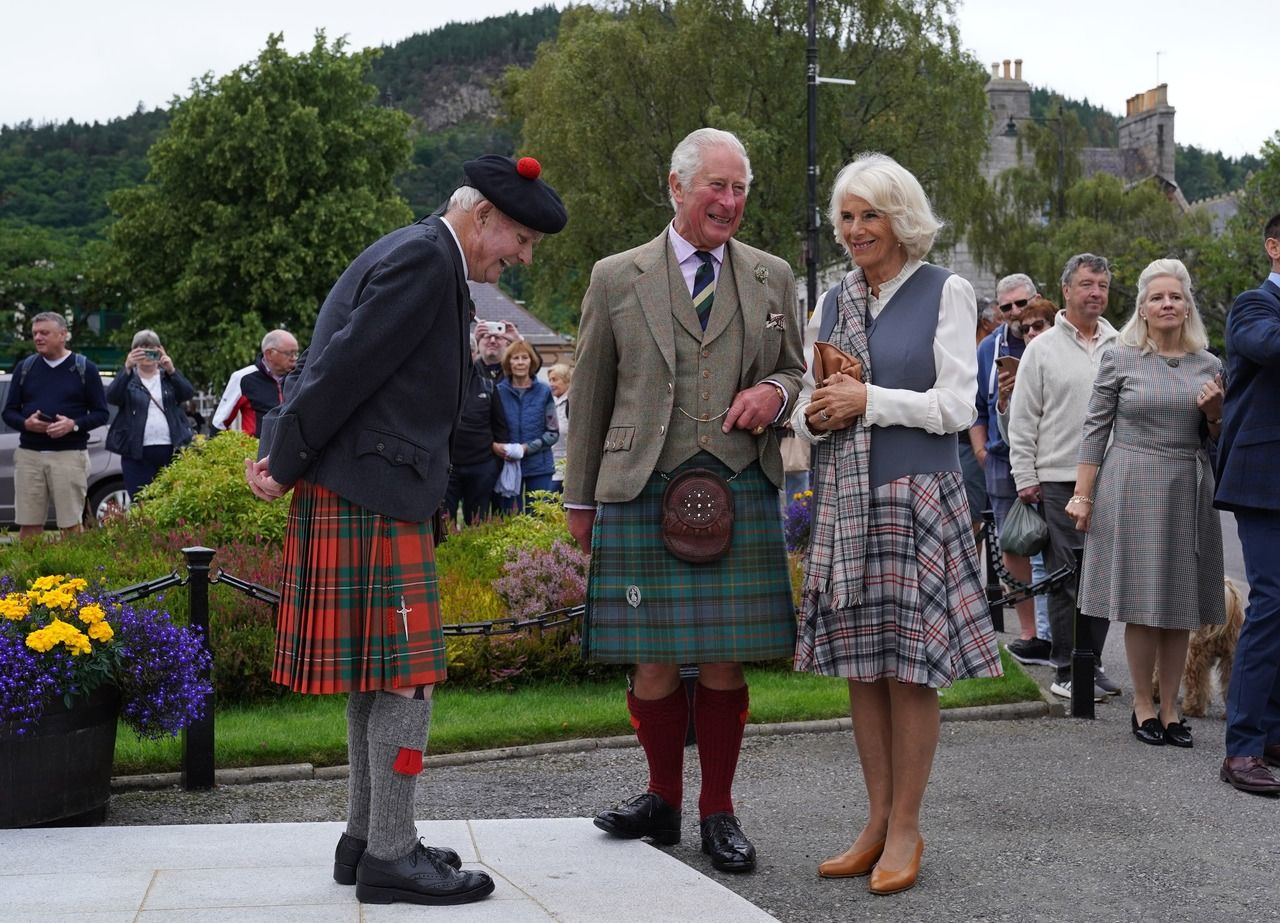 Prince of Wales and the Duchess of Cornwall chat with Hugh Inkster (Andrew Milligan/PA)