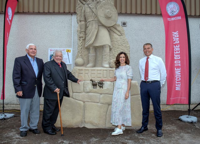 David Birse, Tommy Church, Andrea Brymer and Kevin Mackie at the statue's unveiling. (Brechin City FC/PA)
