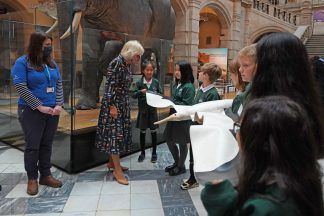 Charles and Camilla meet school pupils during museum visit