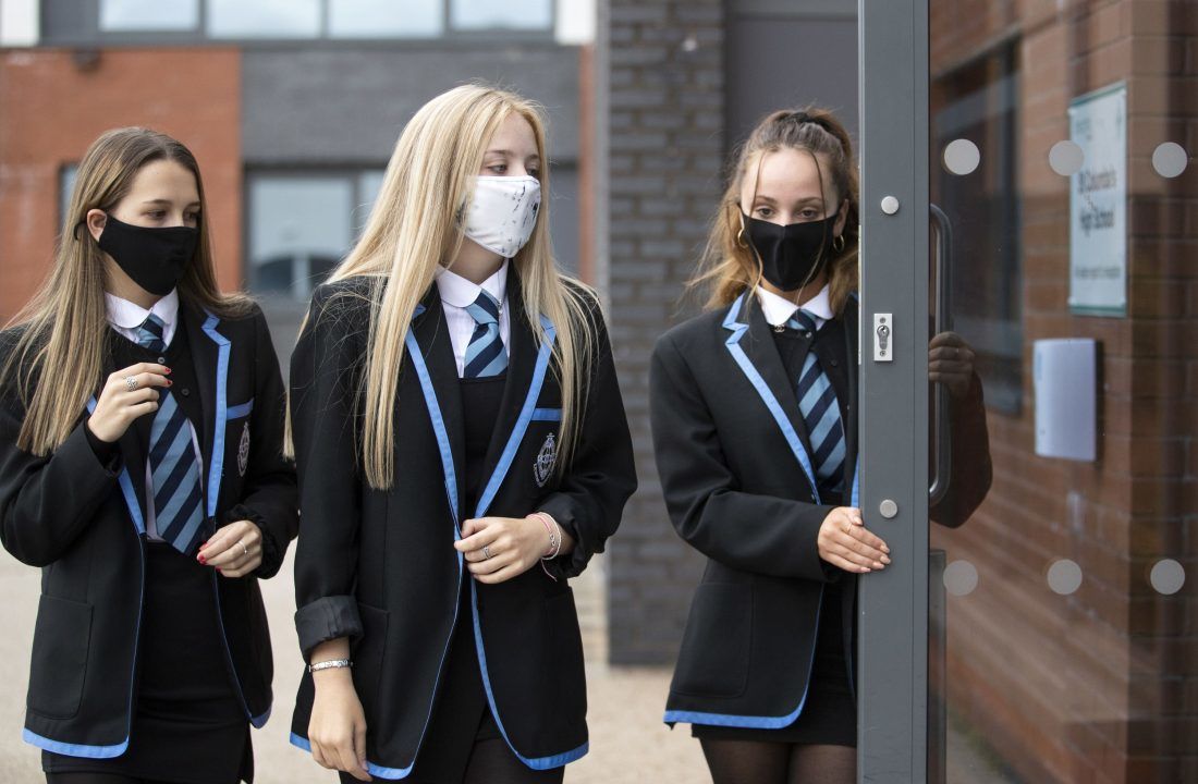 Face coverings and physical distancing rules in schools extended