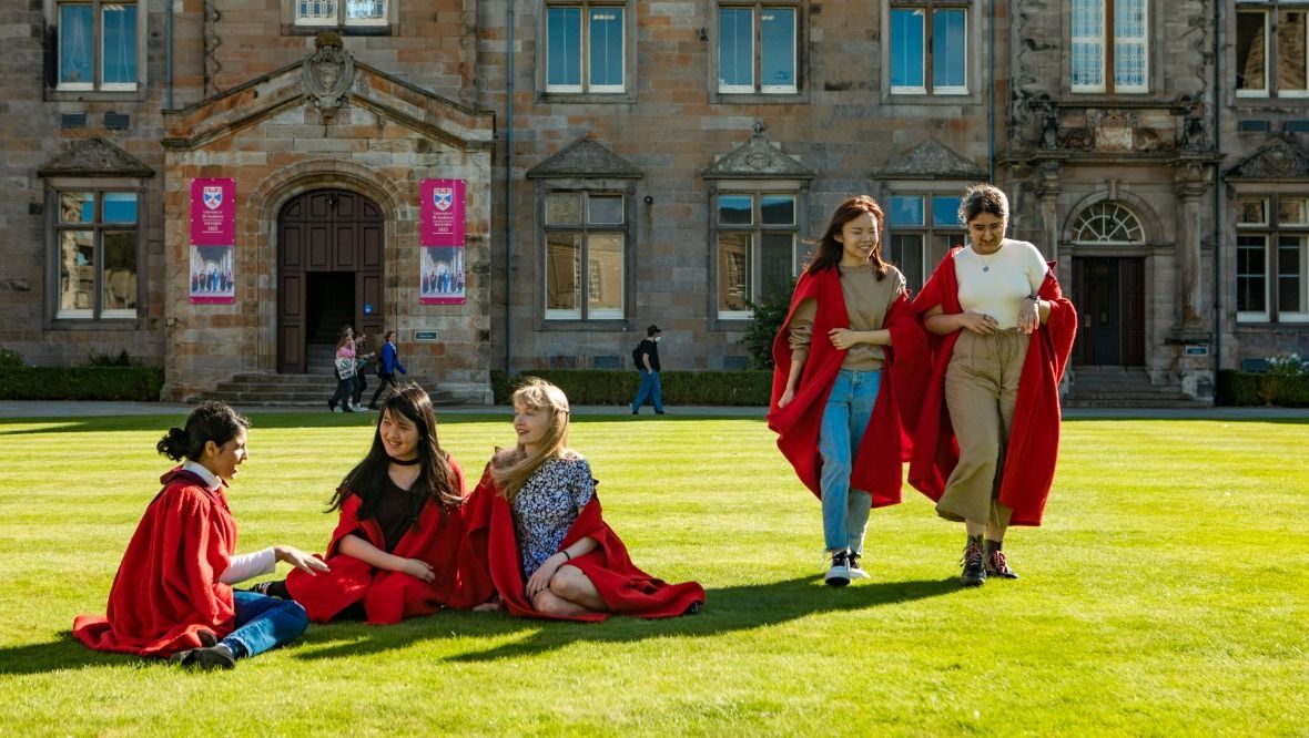 Red Gown ambassadors on St Sallies Lawn. University of St Andrews.