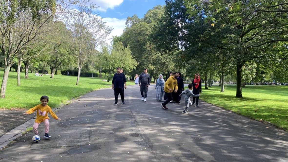 The Rasoli family from Afghanistan enjoying a walk in Glasgow's Kelvingrove Park. 
