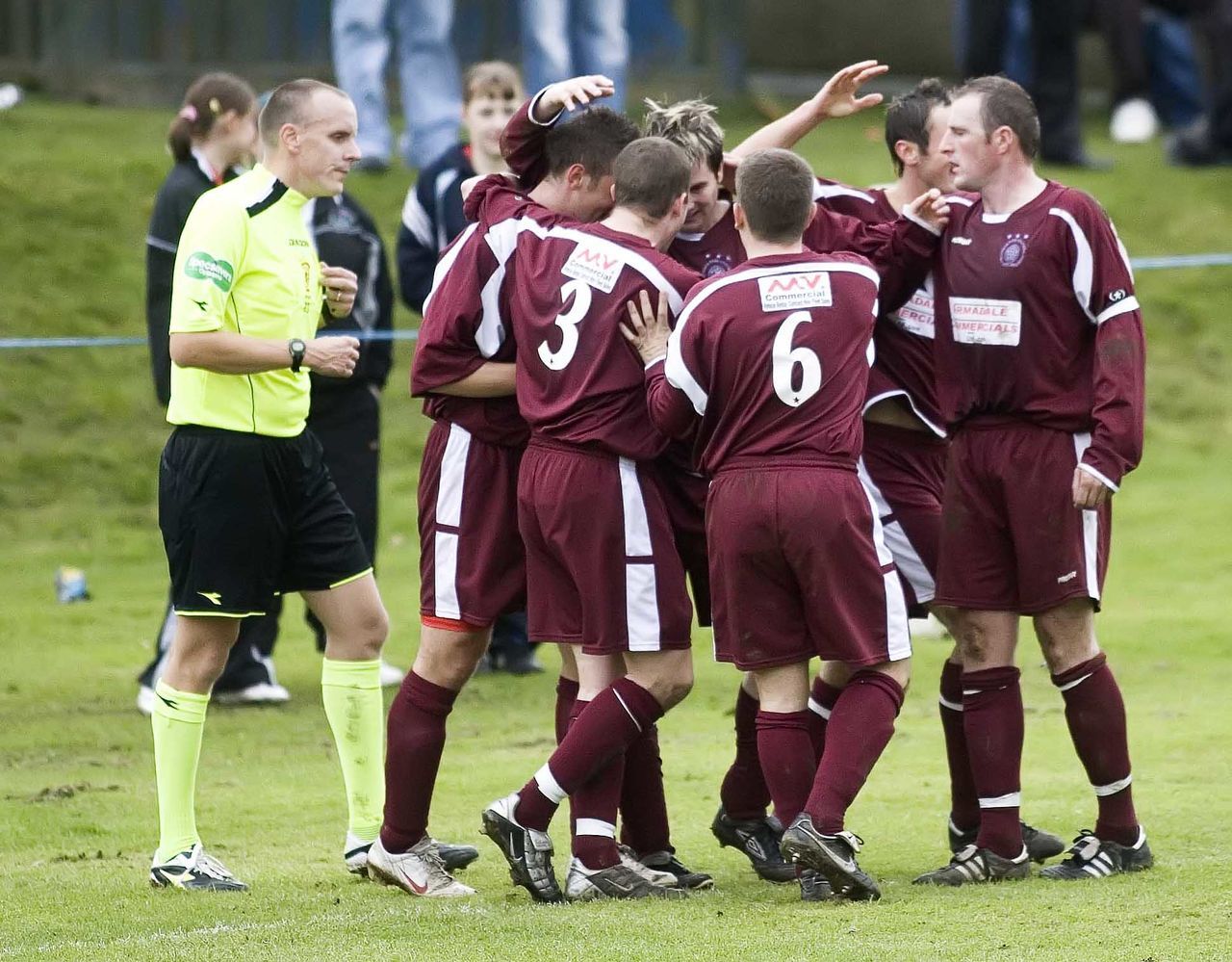 Ian Herd (centre) is congratulated on his goal by his Linlithgow team-mates