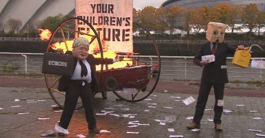 COP26 activist dressed as Boris Johnson sets boat on fire next to Clyde