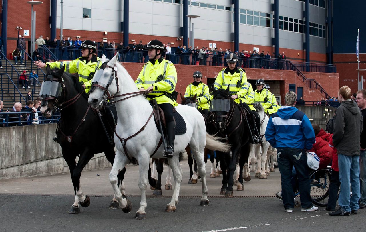 Police horses are often used to help control crowds at football matches.