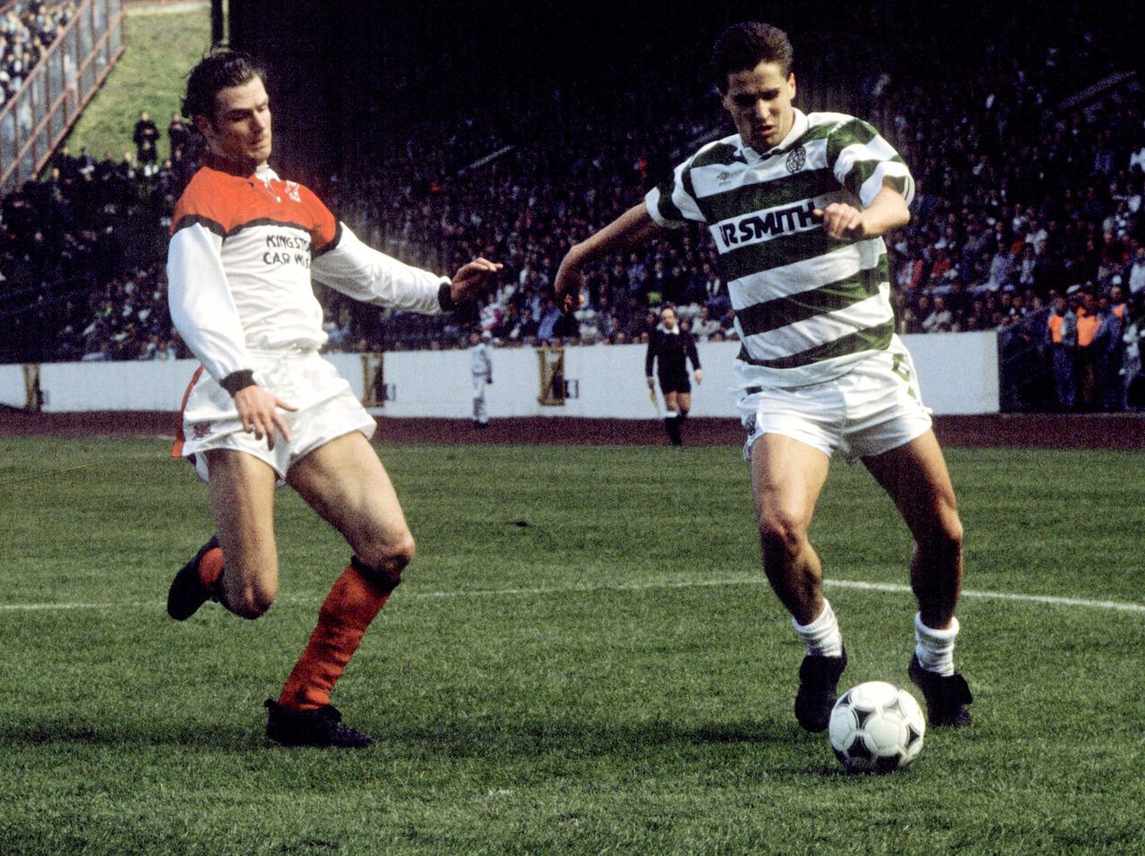 Clydebank's Sean Sweeney chases Celtic striker Dariusz Dziekanowski.