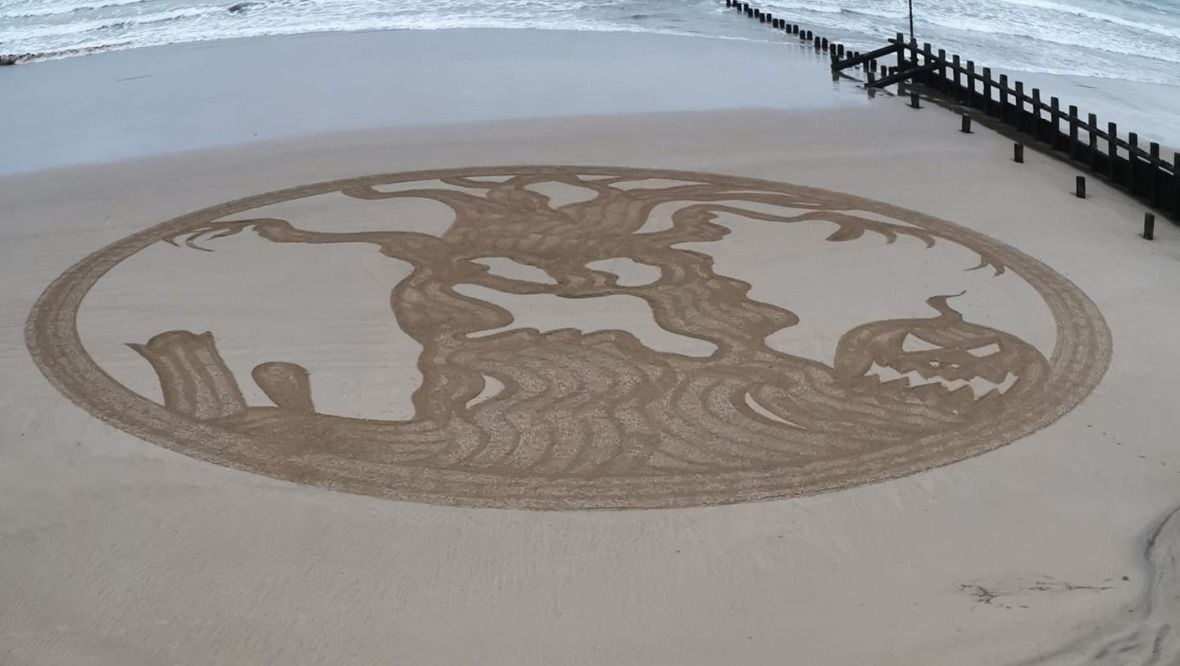 Spooktacular sand art on beach gets locals into Halloween spirit