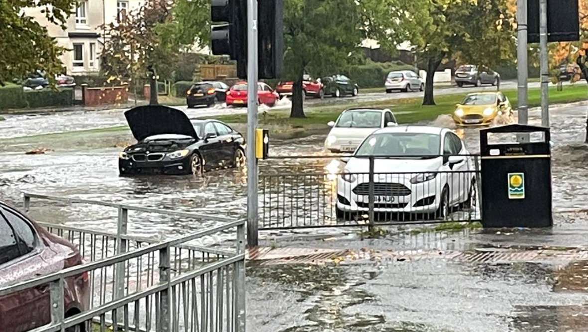 Train services cancelled and roads flooded as rain batters Scotland