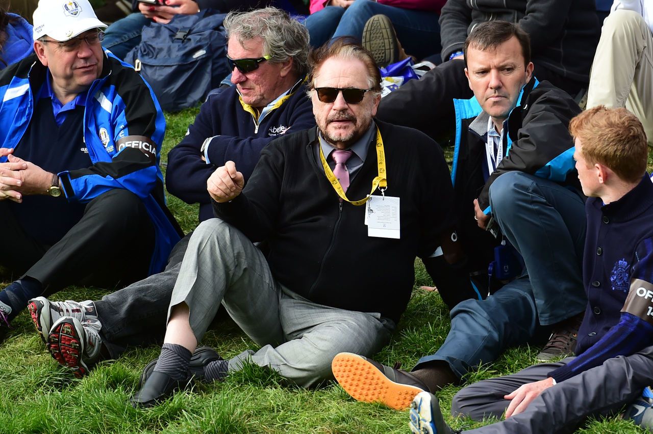 Brian Cox (centre) sits near Alex Salmond during the 2014 Ryder Cup at Gleneagles.