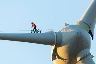 Danny Macaskill cycled across the blade of a wind turbine to raise awareness of climate change.