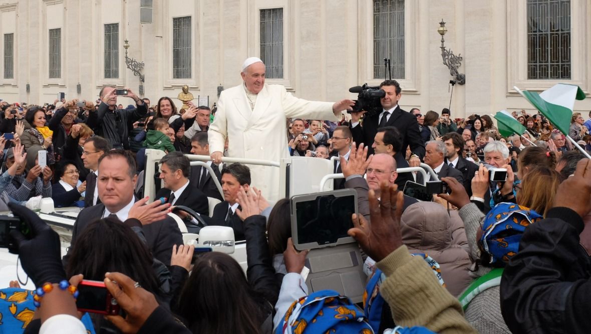 Pope Francis greets attendees at the weekly general audience on October 29, 2014 in Rome.