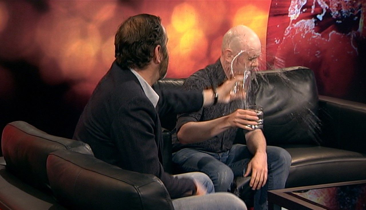 Greg Hemphill chucks a glass of water at Rab Florence.