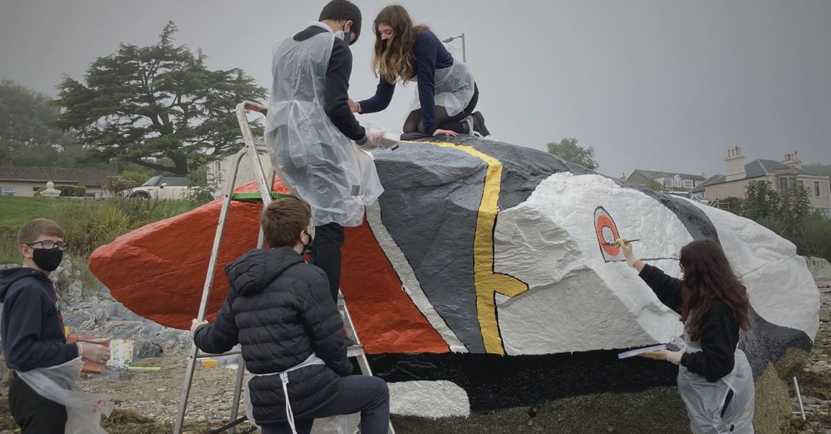 Dunoon Grammar School pupils paint the Puffin Rock.