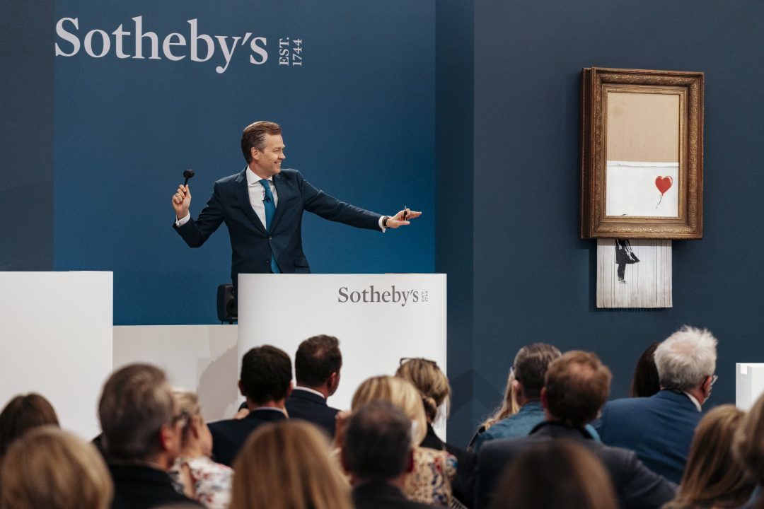 Partially shredded Banksy painting sells for record-breaking £18m