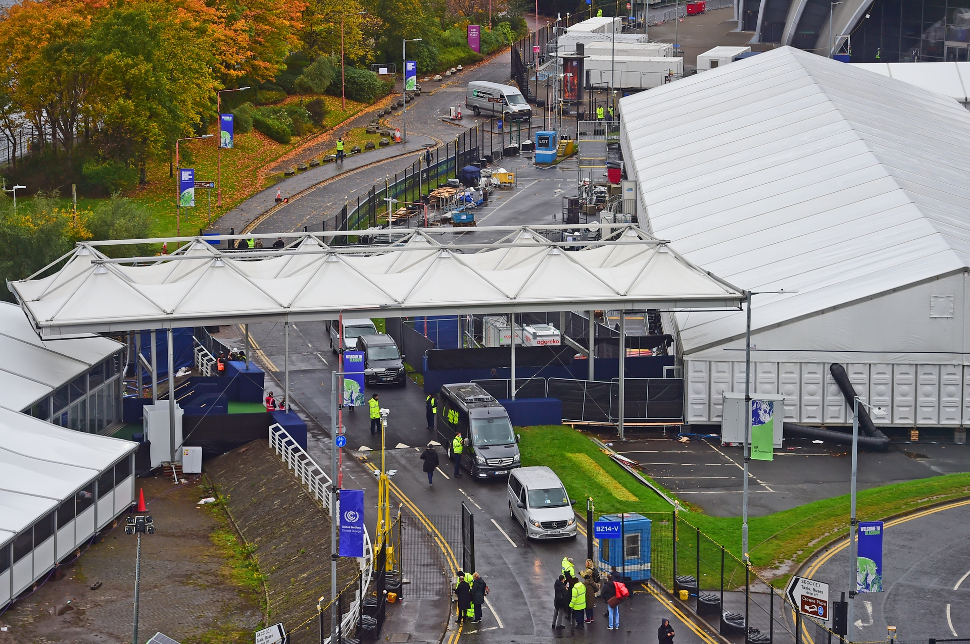 Visitors and vehicles undergo checks at the 'blue zone' entrance.