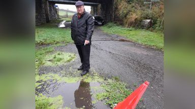 Residents kick up a stink about hole filled with smelly water