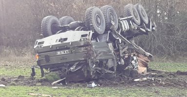 Two injured after Army truck crashes and overturns on roundabout