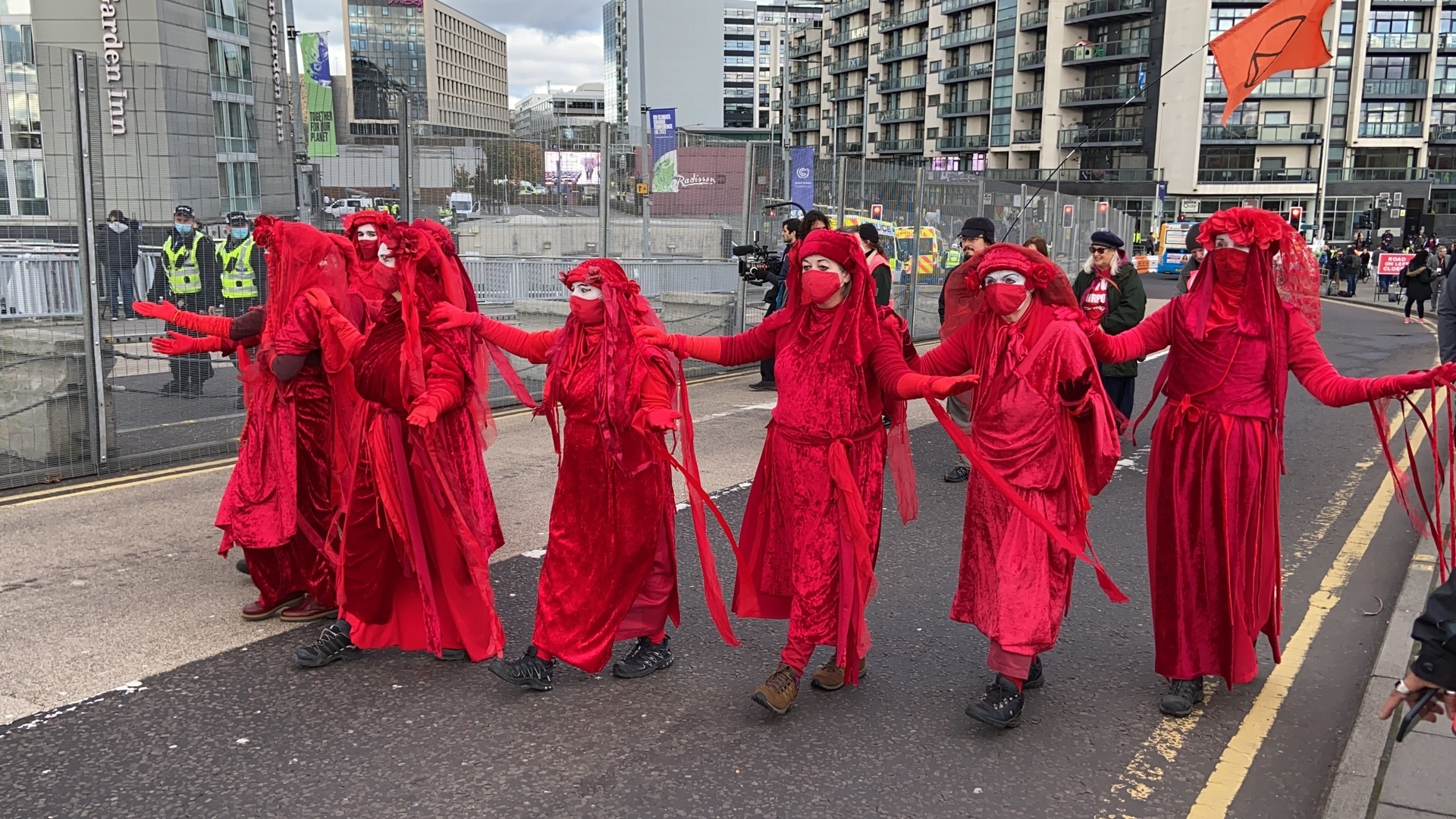 Activists draped in red on the Squinty Bridge on Tuesday afternoon.