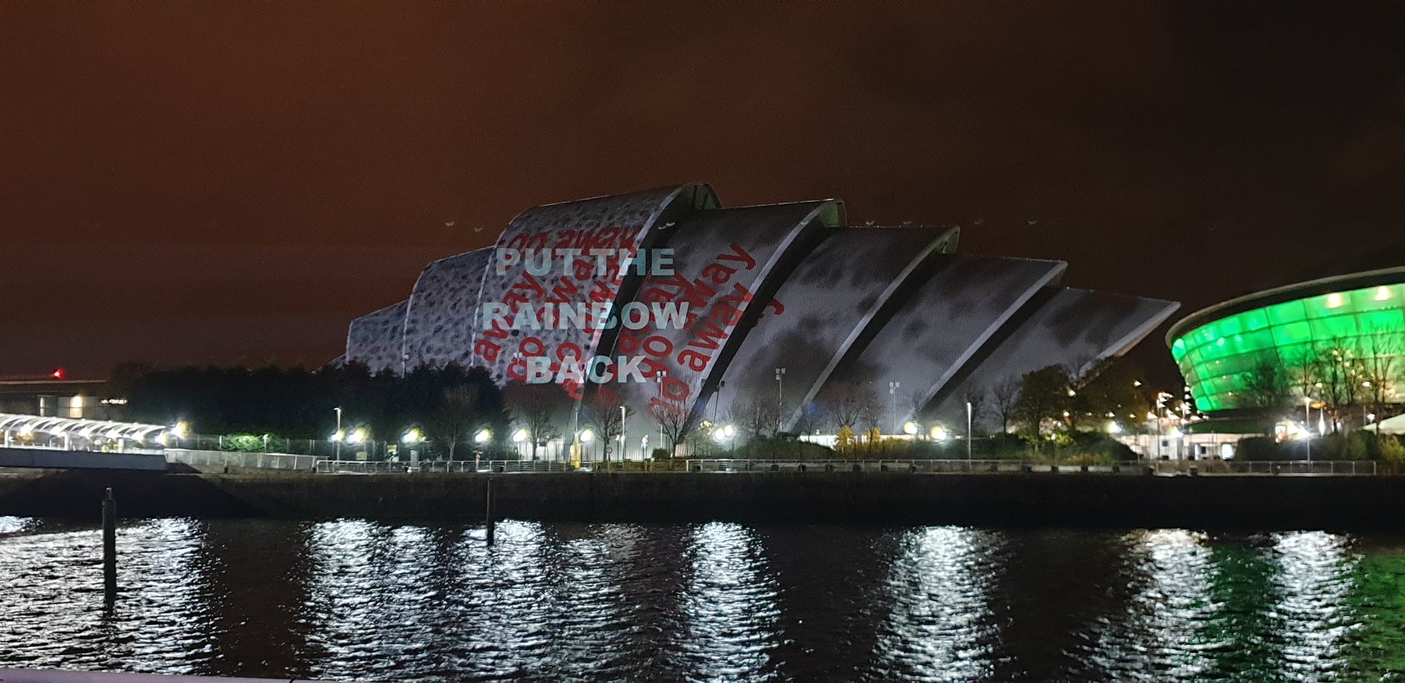 The projector operators tried to obscure the activists’ ‘put the rainbow back’ message.