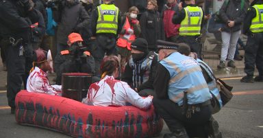 Three arrested as police use power tools to remove locked-on protesters