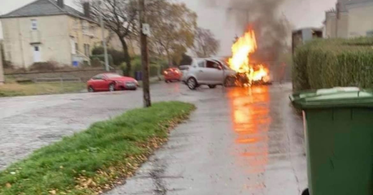 Two men in hospital after crash sees car burst into flames