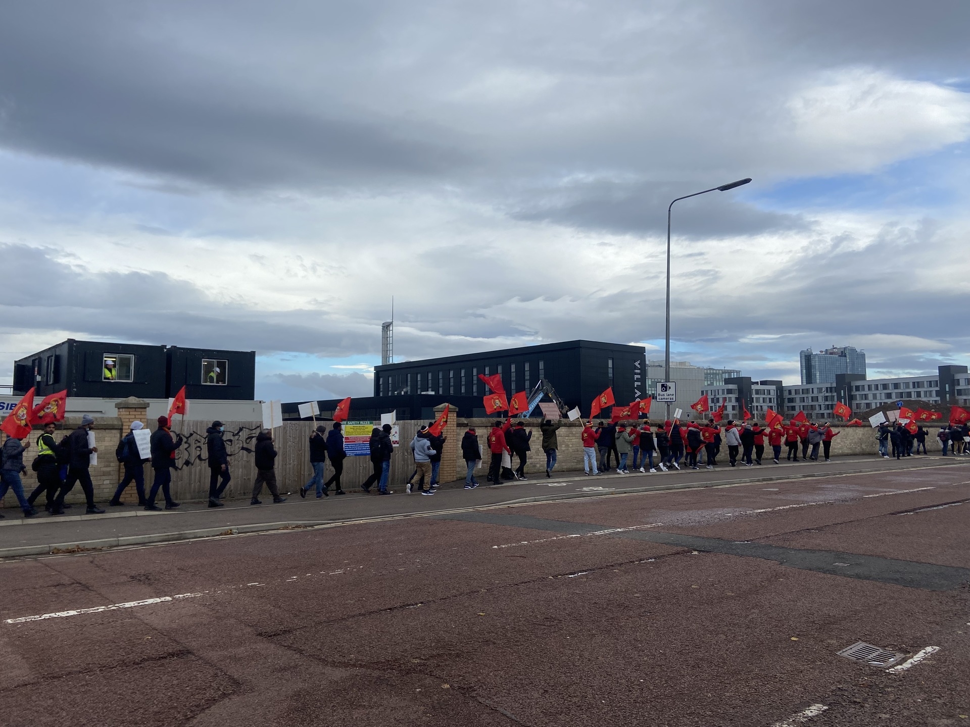 Protestors march through Pacific Quay against the president of Sri Lanka over claims of genocide.