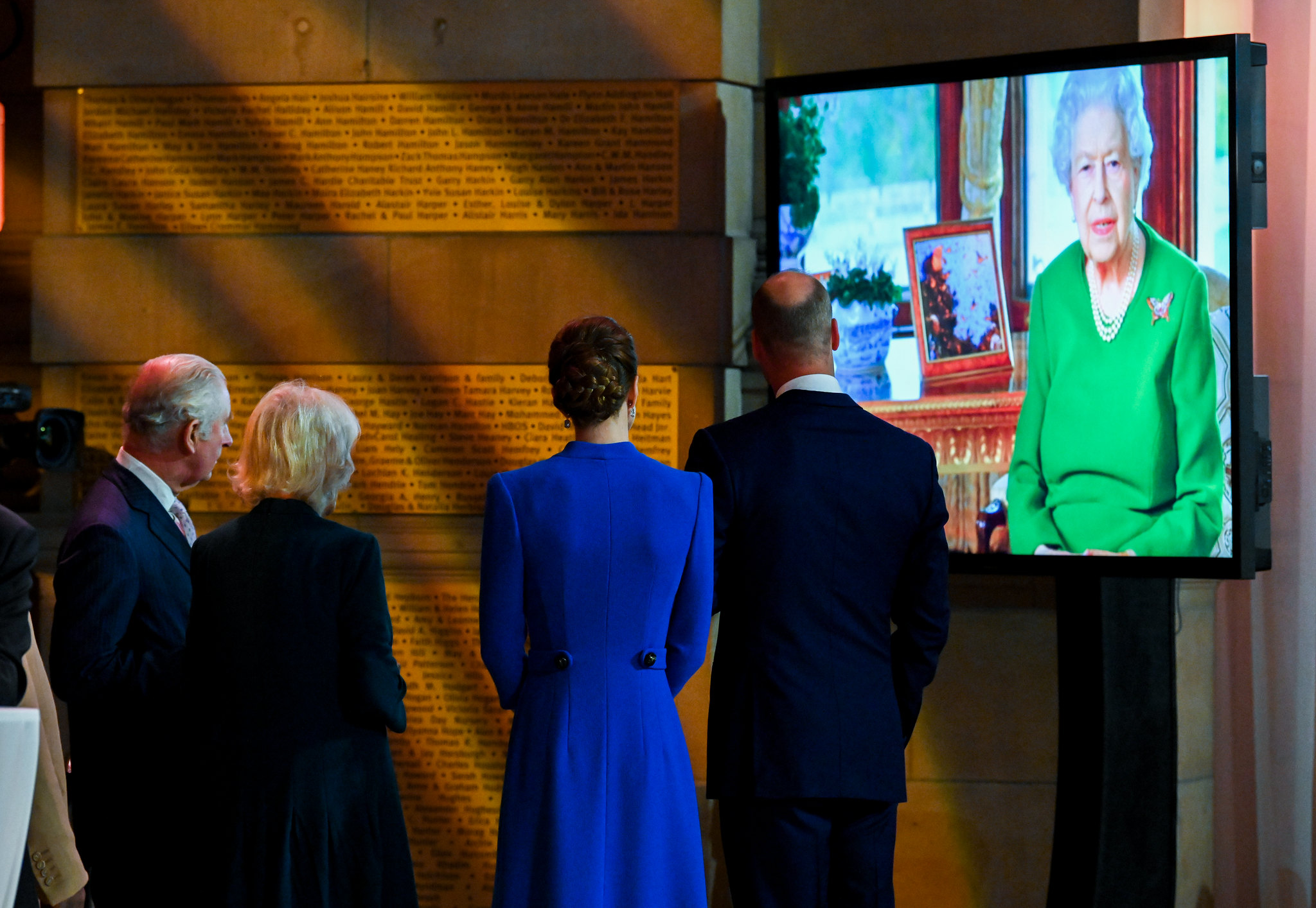 Charles, Prince of Wales, Camilla, Duchess or Cornwall, Catherine, Duchess of Cambridge and William, Duke of Cambridge, watch Queen Elizabeth II onscreen.