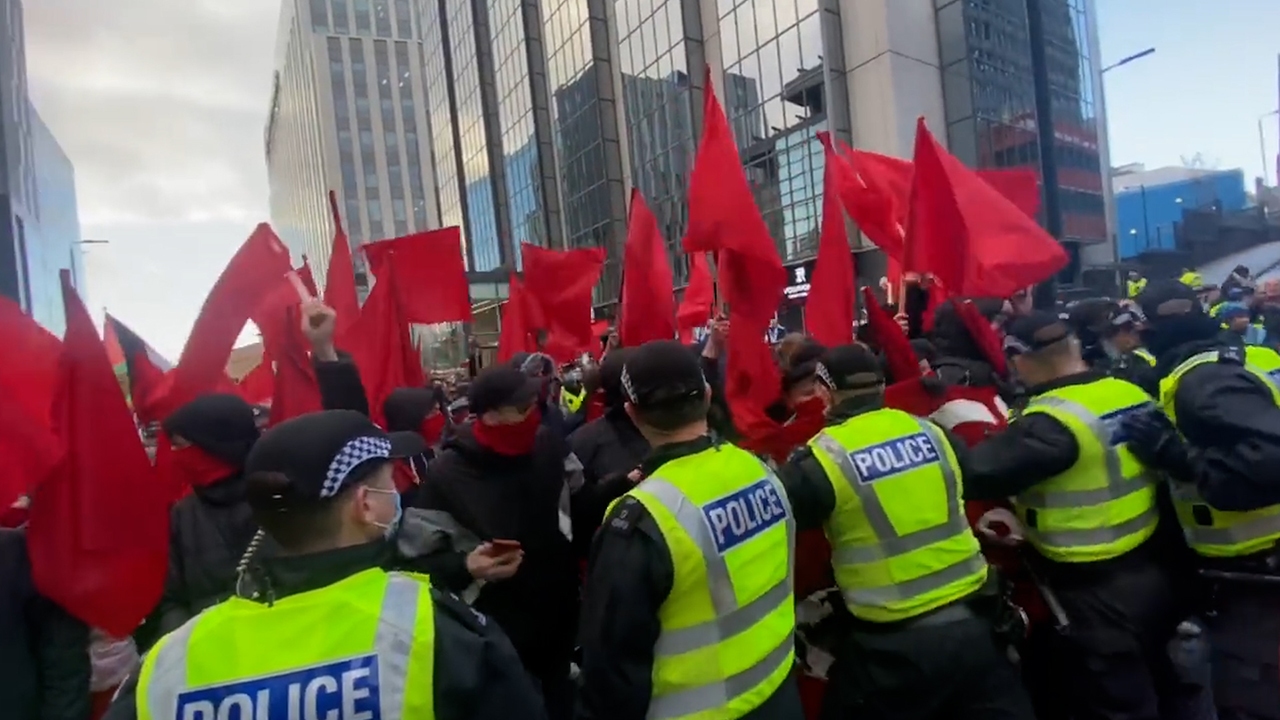 Police separate group in climate march on November 6.