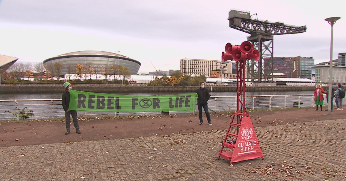 Climate Call-Up, a creative activism project, and Extinction Rebellion sounded the alarm across from COP26.