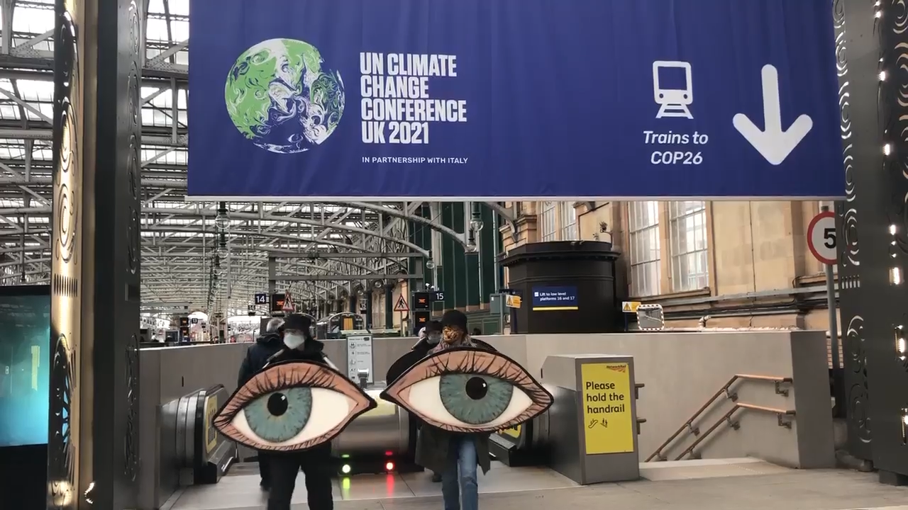 Some Extinction Rebellion (XR) activists arrived in Glasgow from Brighton dressed as a giant pair of eyes.